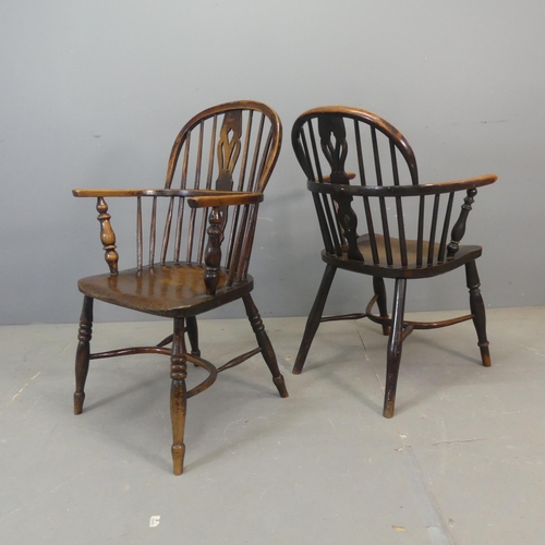 2679 - Two similar 19th century oak comb-back Windsor elbow chairs with crinoline stretchers.