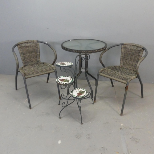 2684 - A circular glass top garden table and two matching chairs, and a painted metal folding three-tier mo... 