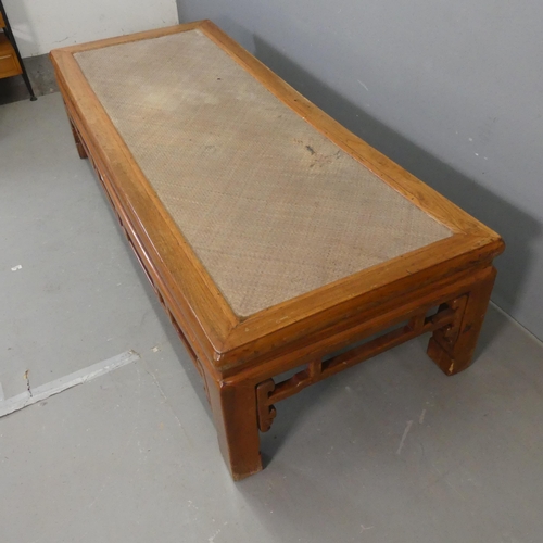 2690 - An early 20th century Chinese elm low rectangular table with rattan top. Length 189cm, height 49cm, ... 