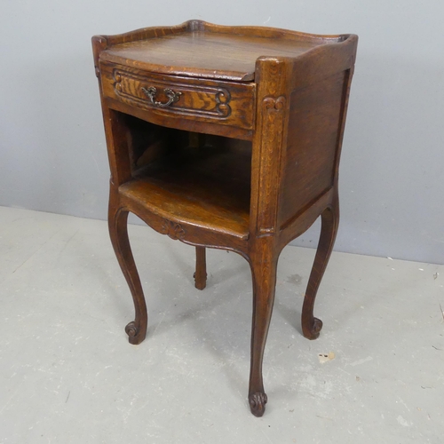 2712 - A French oak pot cupboard, with single drawer, carved decoration and raised on cabriole legs. Width ... 