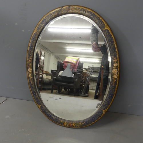 2713 - A painted chinoiserie decorated oval bevel-edged wall mirror. Width 59cm, height 46cm.