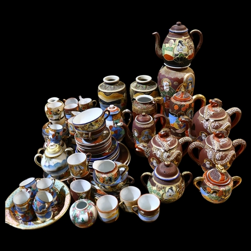 805 - A large quantity of modern Japanese ceramic teaware, various teapots, side plates, saucers and cups,... 