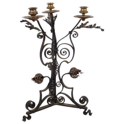 809 - A late Victorian Arts and Crafts 3-branch candelabrum in wrought-iron and brass, in the manner of W ... 