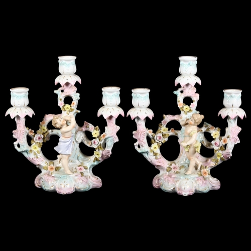 813 - 2 similar German porcelain 3-branch candelabra, each with cherub and floral decoration, German facto... 