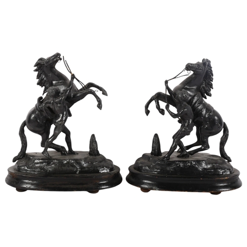 857 - A pair of painted spelter Marley horse groups, on wooden stands, H21cm