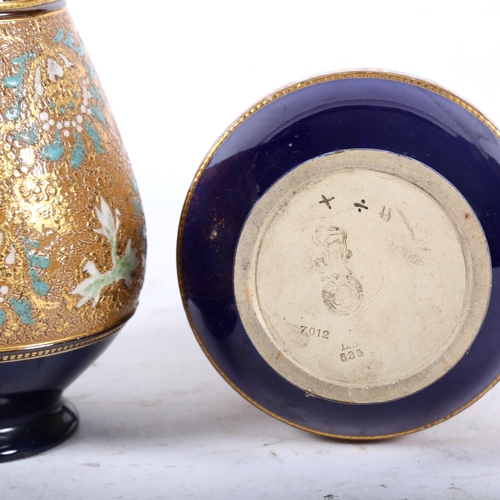 859 - A pair of Royal Doulton cobalt blue ground and gilded vases, H28cm