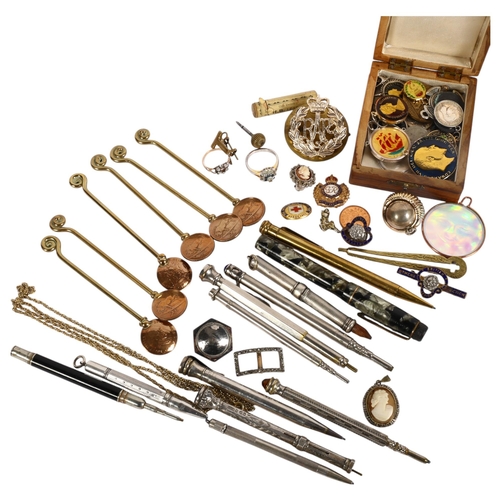 874 - A collection of various propelling pens and pencils, including silver examples, a set of brass spoon... 