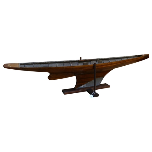 899 - An Antique scratch-built ship's hull, with lead keel, on bespoke wooden base, length approx 163cm