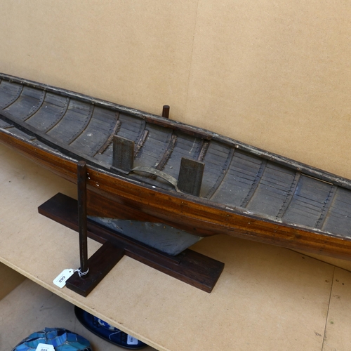 899 - An Antique scratch-built ship's hull, with lead keel, on bespoke wooden base, length approx 163cm