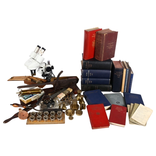 904 - A collection of scientific and medical instruments, including a microscope, guillotine, brass bell w... 