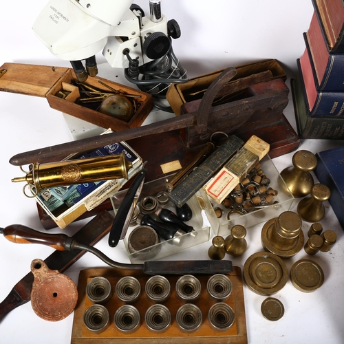 904 - A collection of scientific and medical instruments, including a microscope, guillotine, brass bell w... 