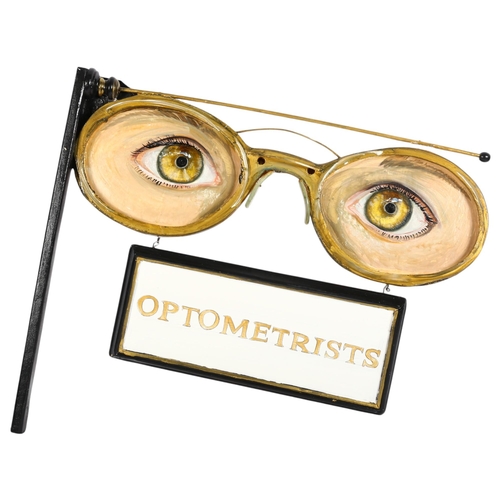 916 - Clive Fredriksson, a Vintage style wooden optometrists wall-hanging sign, L63cm