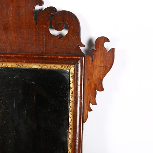 928 - A Georgian mahogany-framed wall mirror, with carved frame, 69cm x 41cm