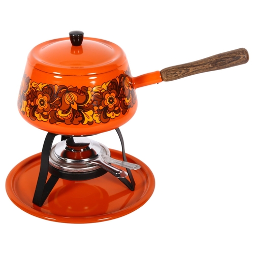 940 - A Vintage orange enamelled fondue set, the saucepan with floral decoration, with label to the unders... 