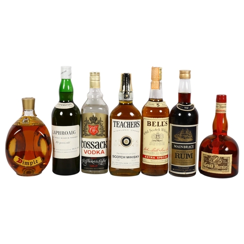 952 - A collection of spirits, including a bottle of Dimple Scotch Whisky, a bottle of Laphroaigh Isle Mal... 