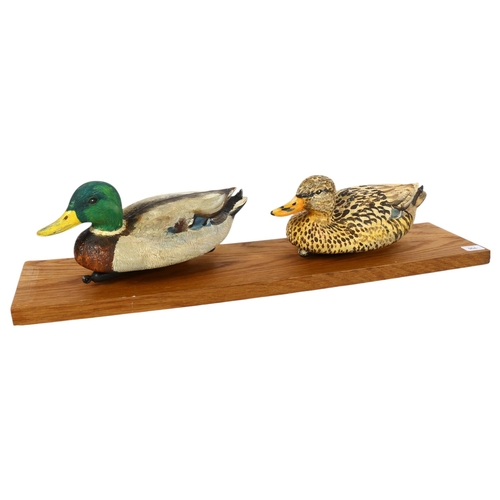 964 - 2 painted plastic decoy ducks on stand, stand length 67cm