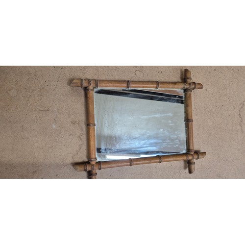 933 - 2 graduated Oxford framed mirrors in bamboo, largest 73cm x 54cm (1 end section A/F)