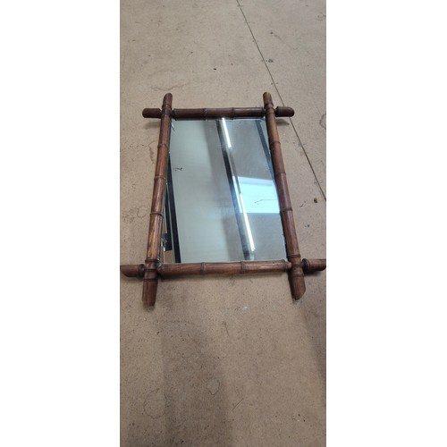 933 - 2 graduated Oxford framed mirrors in bamboo, largest 73cm x 54cm (1 end section A/F)