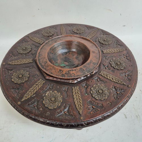 174 - A Spanish carved wood circular brazier, with copper bowl, and applied brass decoration, diameter 43c... 