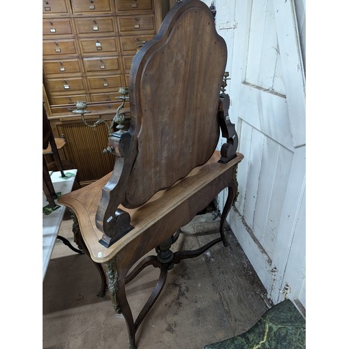 2026 - An antique French kingwood Louis XV style serpentine fronted dressing table, with raised mirrored ba... 