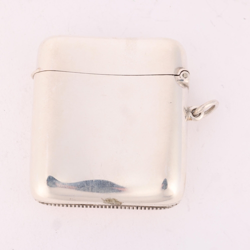 100 - An Edwardian silver Vesta case, Deakin & Francis, Birmingham 1901, curved rectangular form with spru... 