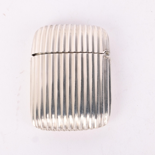 101 - A Victorian silver Vesta case, indistinct maker, Birmingham 1891, rounded rectangular form with flut... 
