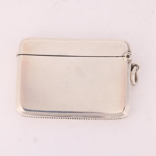 117 - A George V silver Vesta case, Gourdel Vales & Co, 1919, curved rectangular form with gilt interior, ... 