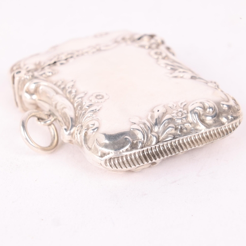 121 - A late Victorian silver Vesta case, Levi & Salaman, Birmingham 1896, shaped rectangular form with re... 