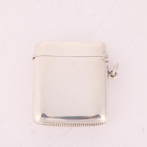 137 - An Edwardian silver Vesta case, Deakin & Francis, Birmingham 1907, curved rectangular form plain for... 