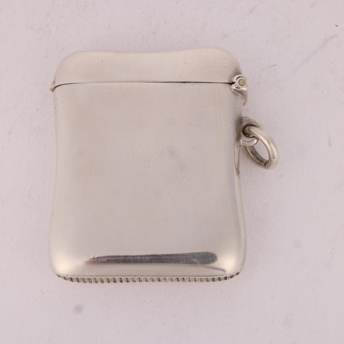 142 - A late Victorian silver Vesta case, Henry Matthews, Birmingham 1899, shaped rectangular form with re... 