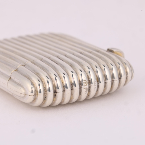 15 - SAMPSON MORDAN & CO - a Victorian silver Vesta case, London 1889, rectangular form with fluted decor... 