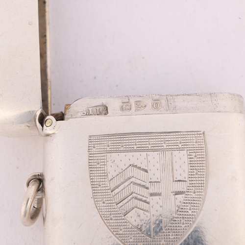 164 - A late Victorian silver 'Armorial' Vesta case, Stokes & Ireland Ltd, Chester 1897, rounded rectangul... 