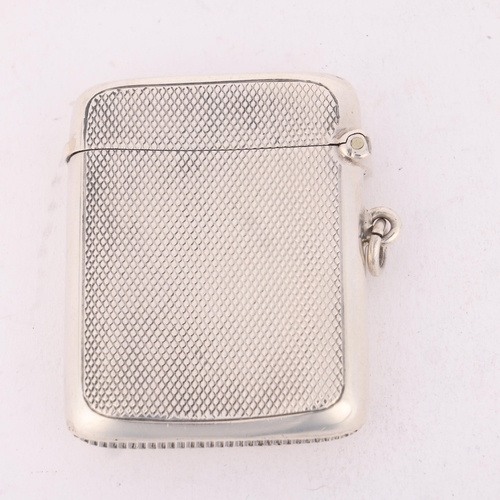 172 - An Edwardian silver Vesta case, JW Benson Ltd, Birmingham 1903, curved rectangular form with allover... 