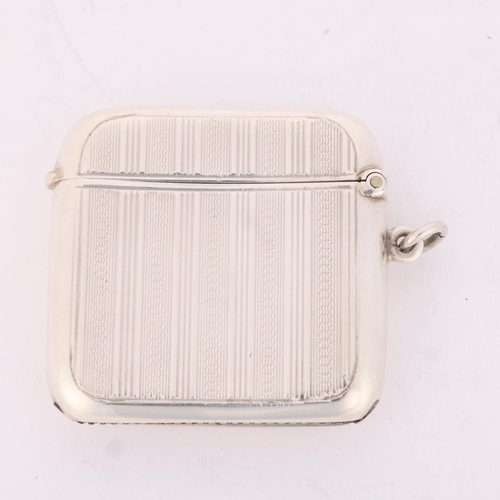 176 - An Art Deco George VI silver Vesta case, maker RN, Birmingham 1945, curved rectangular form with all... 