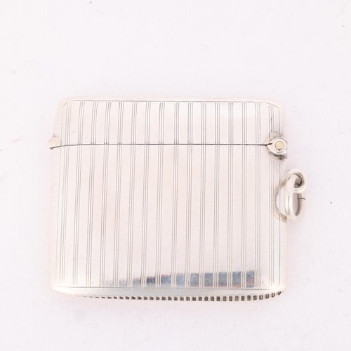 183 - An Art Deco George V silver Vesta case, Henry Matthews, Birmingham 1920, rectangular form with engin... 