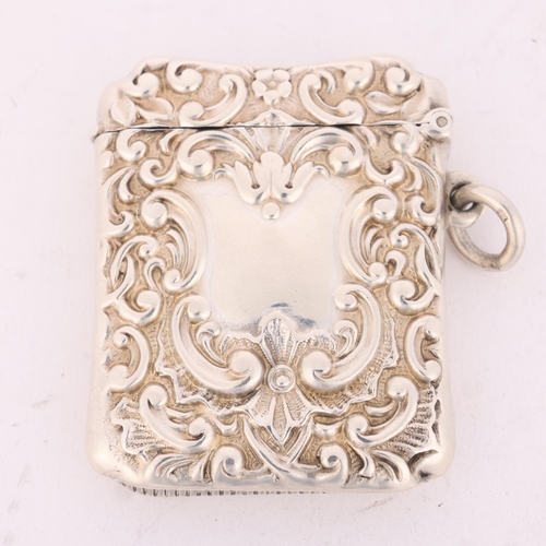 184 - A late Victorian silver Vesta case, Henry Matthews, Birmingham 1899, shaped rectangular form with al... 