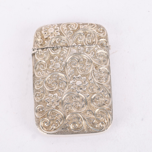 185 - A Victorian silver Vesta case, Adie & Lovekin, Birmingham 1886, rectangular form with allover relief... 