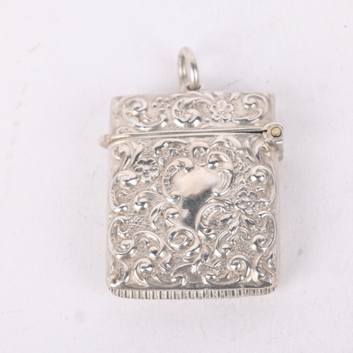 191 - An Edwardian silver Vesta case, AW Gamage Ltd, Birmingham 1905, rectangular form with allover relief... 