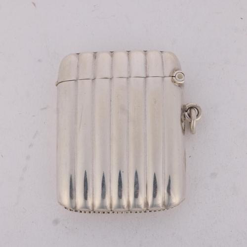 194 - A George V silver Vesta case, Thomas Hayes, Birmingham 1911, rectangular form with fluted decoration... 