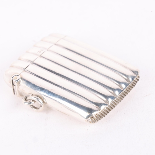 194 - A George V silver Vesta case, Thomas Hayes, Birmingham 1911, rectangular form with fluted decoration... 