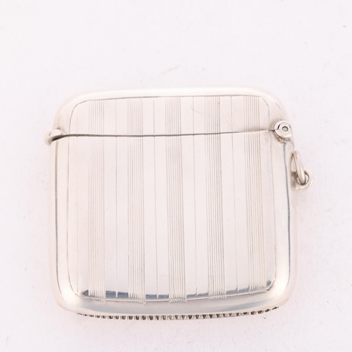 200 - An Art Deco George V silver Vesta case, John Rose, Birmingham 1915, curved square form with engine t... 