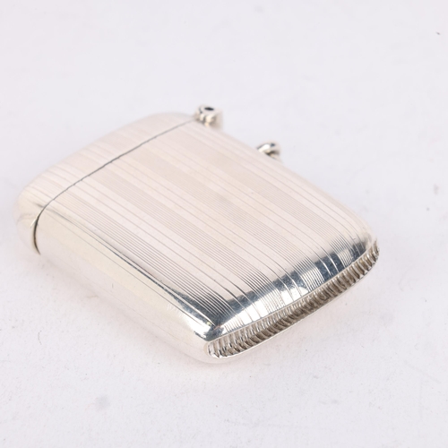 203 - An Edwardian silver Vesta case, William Neale & Sons, Chester 1908, rectangular form with allover en... 