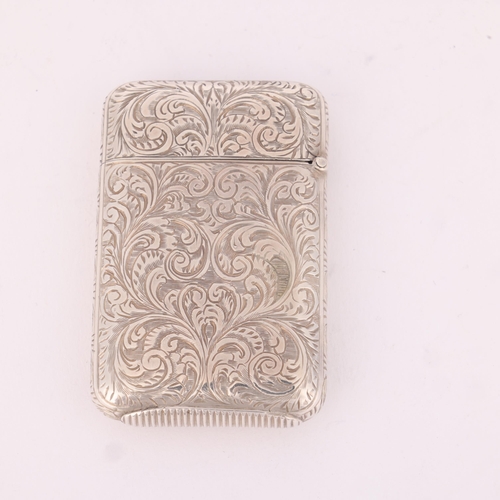 21 - SAMPSON MORDAN & CO - a Victorian silver Vesta case, London 1880, rectangular form with allover chas... 