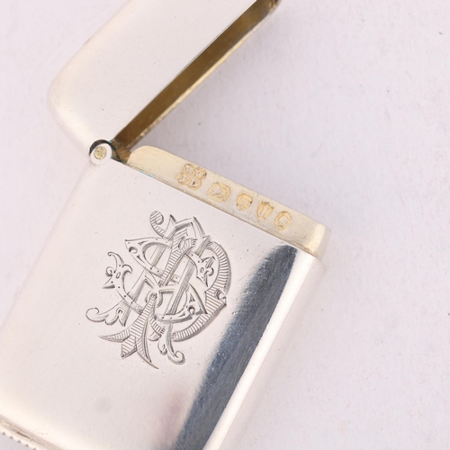 210 - A Victorian silver Vesta case, Wright & Davies, London 1884, plain rectangular form with gilt interi... 