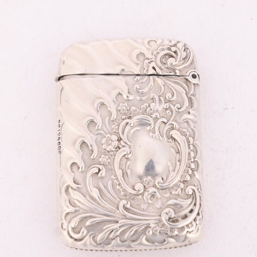 223 - A late Victorian silver Vesta case, Minshull & Latimer, Birmingham 1894, rectangular form with allov... 