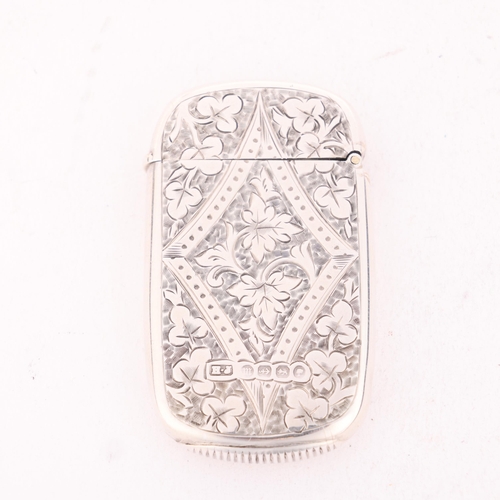 225 - A Victorian silver Vesta case, Howard James, Birmingham 1886, oval form with allover foliate engrave... 