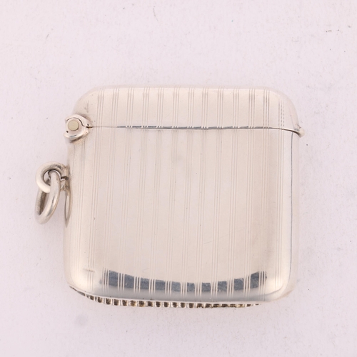 226 - A George V silver Vesta case, Joseph Gloster Ltd, Birmingham 1915, curved rectangular form with allo... 