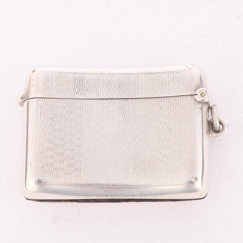 242 - A George V silver Vesta case, A&J Zimmerman, Birmingham 1911, curved rectangular form with allover e... 