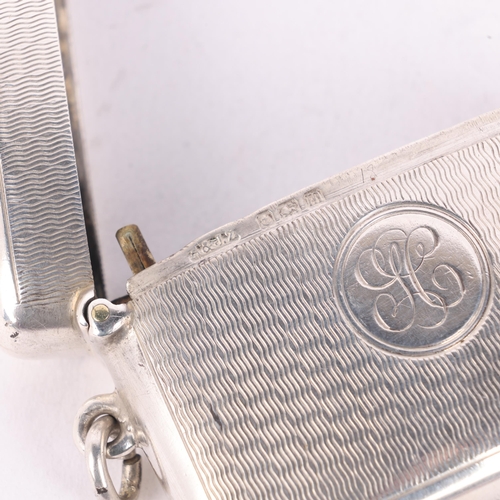 242 - A George V silver Vesta case, A&J Zimmerman, Birmingham 1911, curved rectangular form with allover e... 