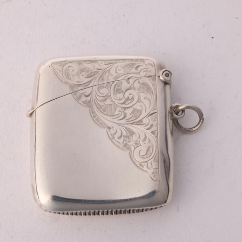 248 - An Edwardian silver Vesta case, Charles S Green & Co, Birmingham 1908, curved rectangular form with ... 